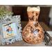 This is a handmade gourd vase made with a dried gourd. The front has butterfly artwork drawn on using pyrography tools.